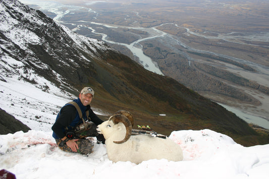 Cameron Hanes pulling AK Dall sheep from ledge