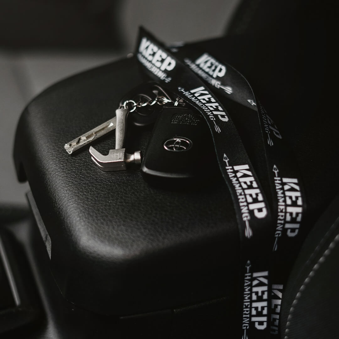 Car keys with a lanyard on a car seat